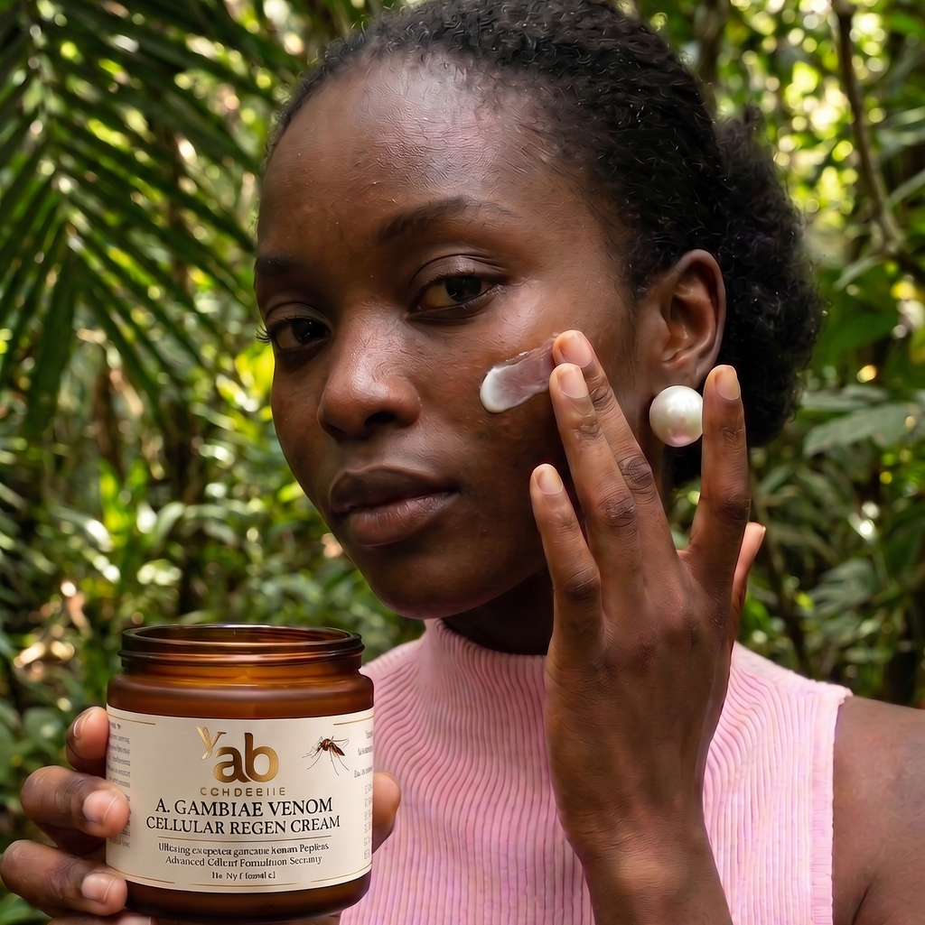 Woman applying Aichabelle A. Gambiae Venom cellular regeneration cream to her face